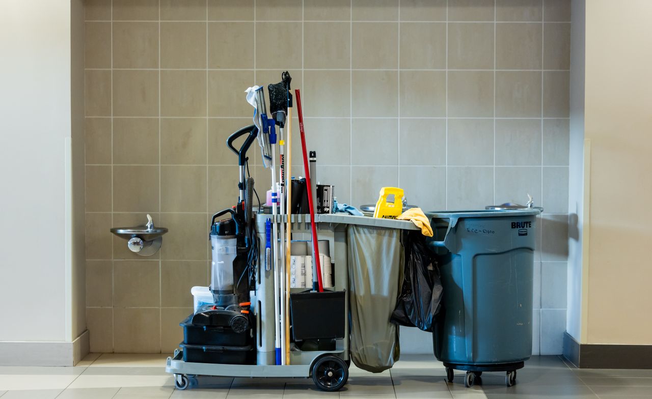gallery-6 A comprehensive collection of professional cleaning tools on a cart in an indoor environment.